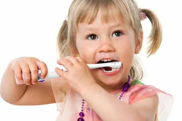 Child shows brushing technique