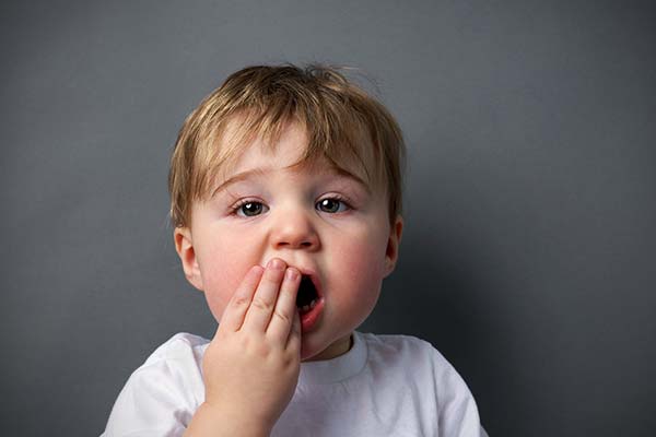 Child is showing the sore tooth to bendigo dentist