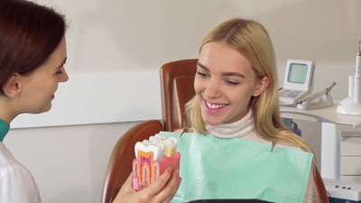 Dentist in Bendigo explaining tooth pulled out procedure to patient