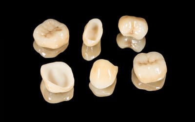 Porcelain dental crowns on display